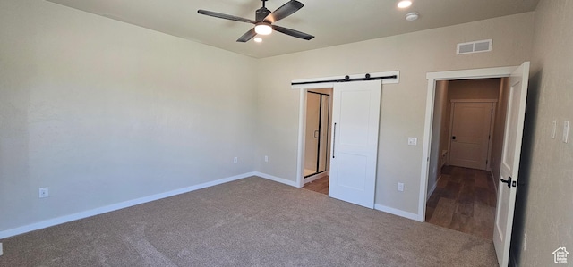 831 N 1820 E Unit 66, Price, UT 84501 - unfurnished bedroom with carpet, a barn door, and ceiling fan