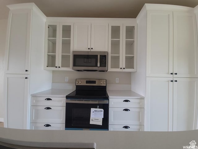 1871 E 840 N Unit 84, Price, UT 84501 - kitchen featuring appliances with stainless steel finishes and white cabinetry