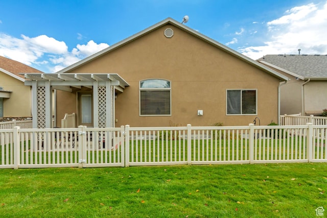 10976 Quartz Dr, South Jordan, UT 84095 - rear view of property featuring a yard, a fenced front yard, stucco siding, and a pergola