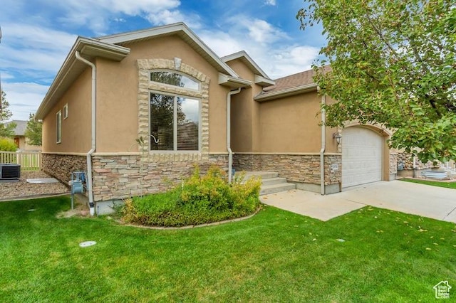 10976 Quartz Dr, South Jordan, UT 84095 - view of front facade featuring a front yard, stone siding, a garage, stucco siding, and driveway