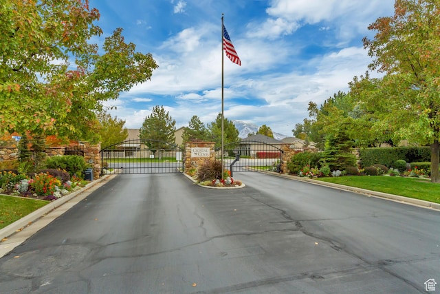 10976 Quartz Dr, South Jordan, UT 84095 - view of street featuring curbs, a gated entry, and a gate
