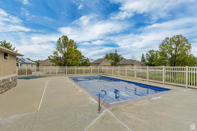 10976 Quartz Dr, South Jordan, UT 84095 - community pool with a patio area and fence private yard