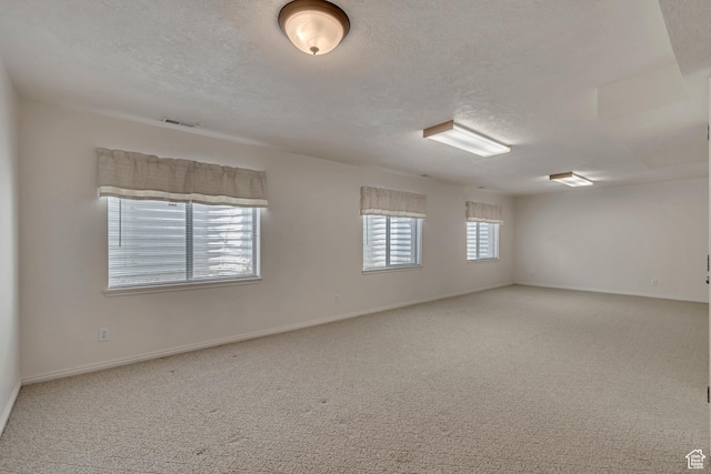 10976 Quartz Dr, South Jordan, UT 84095 - carpeted empty room featuring visible vents, a textured ceiling, and baseboards