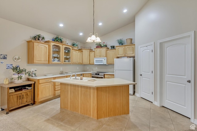 10976 Quartz Dr, South Jordan, UT 84095 - kitchen with a sink, light brown cabinetry, white appliances, and an island with sink