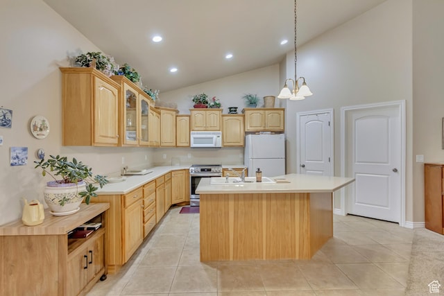 10976 Quartz Dr, South Jordan, UT 84095 - kitchen featuring light tile patterned floors, white appliances, glass insert cabinets, light brown cabinetry, and a center island with sink