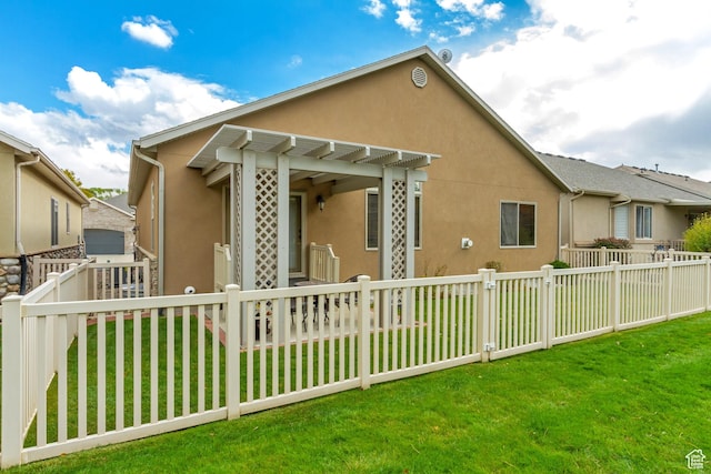10976 Quartz Dr, South Jordan, UT 84095 - view of home's exterior featuring a fenced backyard, a pergola, a lawn, and stucco siding