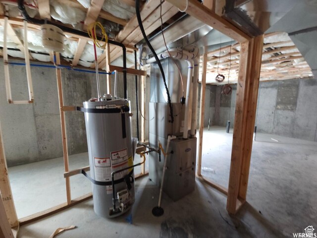 854 N 1880 E Unit 72, Price, UT 84501 - utility room featuring strapped water heater and heating unit