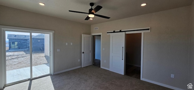 854 N 1880 E Unit 72, Price, UT 84501 - unfurnished bedroom featuring ceiling fan, a barn door, access to exterior, and carpet floors