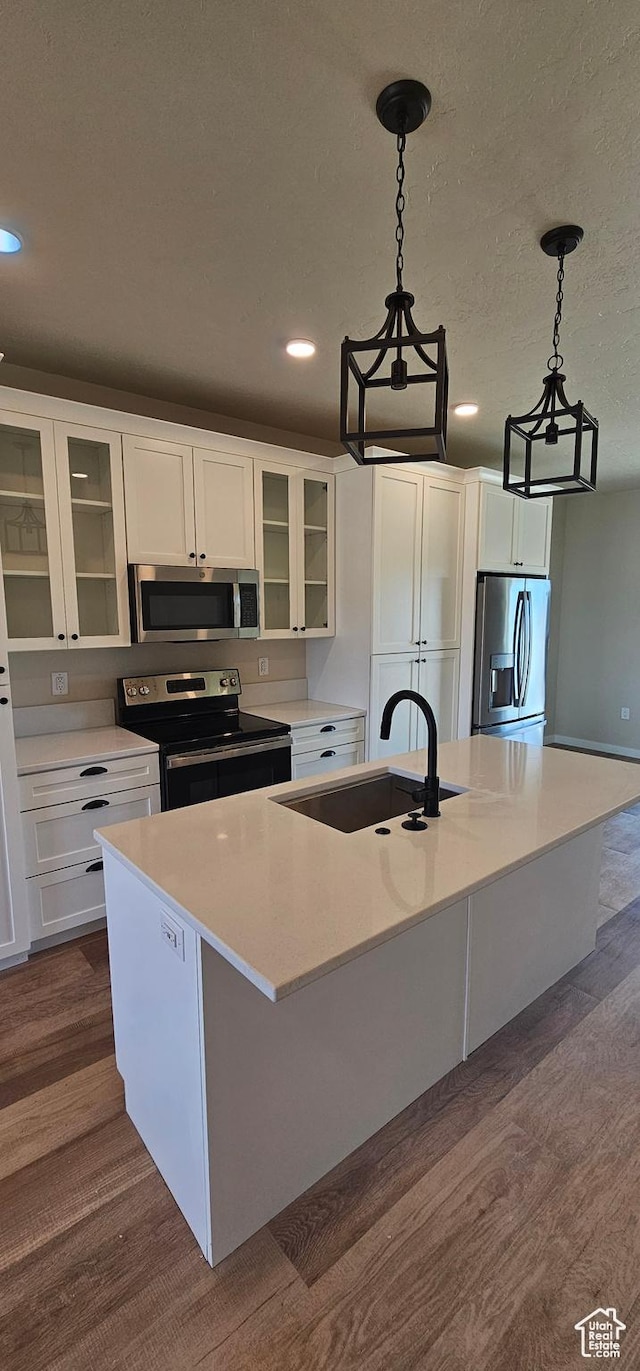 854 N 1880 E Unit 72, Price, UT 84501 - kitchen with white cabinets, sink, an island with sink, and appliances with stainless steel finishes