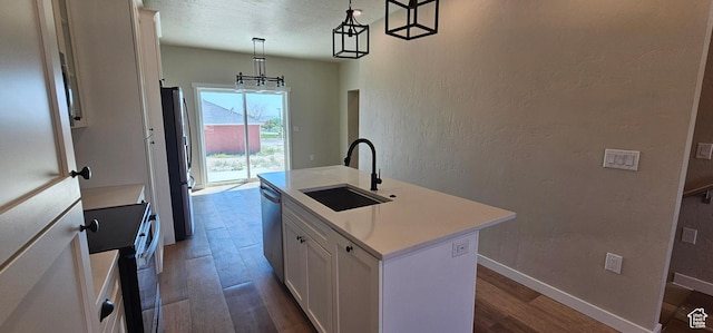 1840 E 840 N Unit 81, Price, UT 84501 - kitchen with white cabinets, sink, an island with sink, decorative light fixtures, and stainless steel appliances