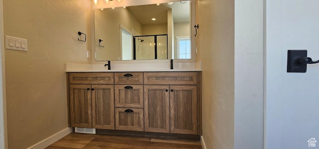 1840 E 840 N Unit 81, Price, UT 84501 - bathroom featuring wood-type flooring, vanity, and an enclosed shower