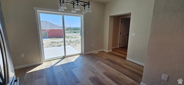 1840 E 840 N Unit 81, Price, UT 84501 - unfurnished dining area with hardwood / wood-style floors and a chandelier