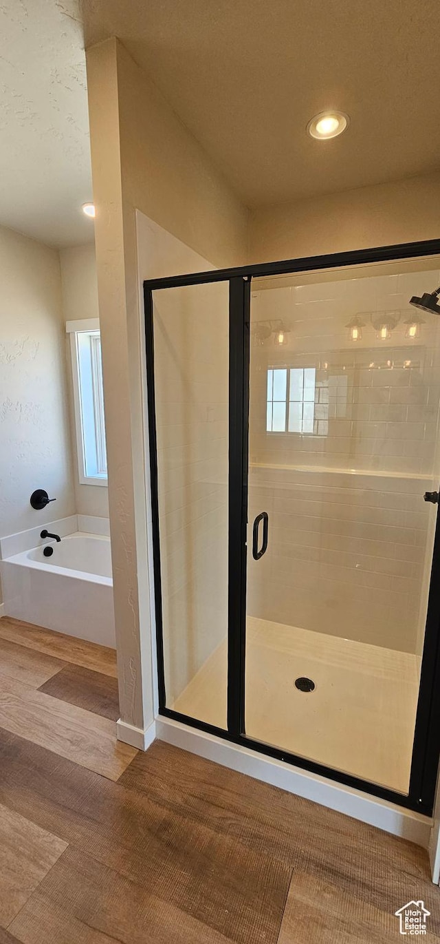 1840 E 840 N Unit 81, Price, UT 84501 - bathroom featuring hardwood / wood-style flooring and independent shower and bath