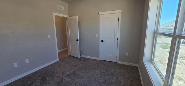 1843 E 840 N Unit 86, Price, UT 84501 - unfurnished bedroom featuring dark carpet