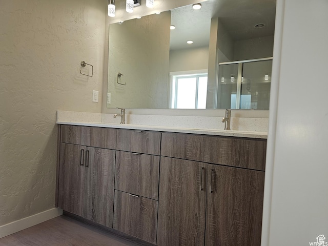 1858 E 840 N Unit 82, Price, UT 84501 - bathroom featuring vanity, hardwood / wood-style flooring, and a shower with door