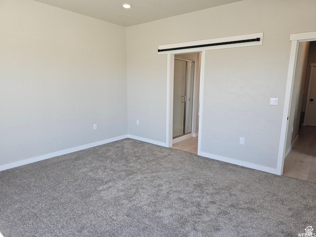 1858 E 840 N Unit 82, Price, UT 84501 - carpeted empty room featuring a barn door