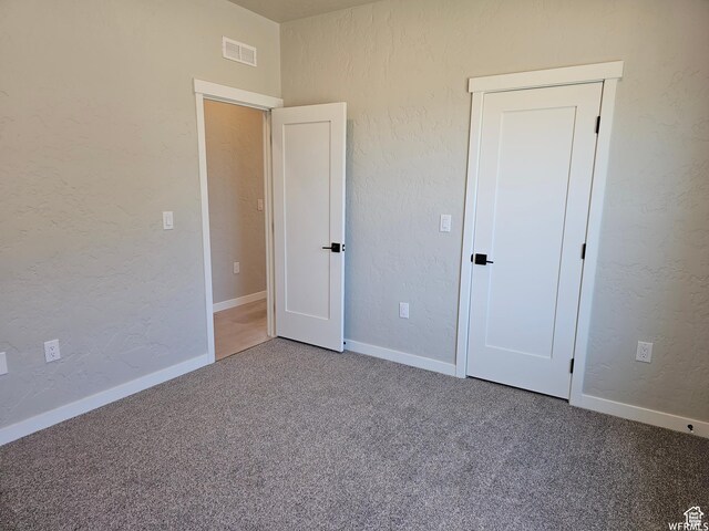 1858 E 840 N Unit 82, Price, UT 84501 - unfurnished bedroom featuring carpet flooring