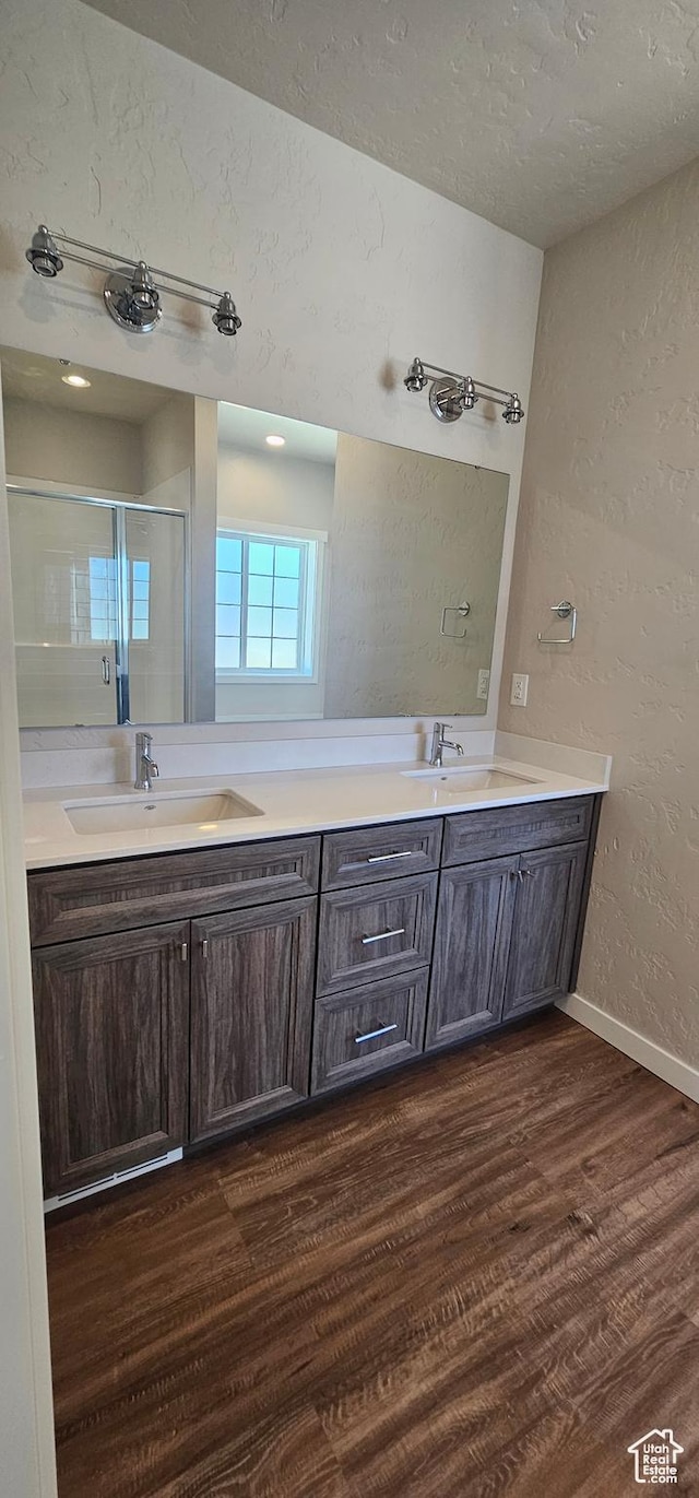 1829 E 840 N Unit 87, Price, UT 84501 - bathroom with hardwood / wood-style floors, vanity, a shower with door, and a textured ceiling
