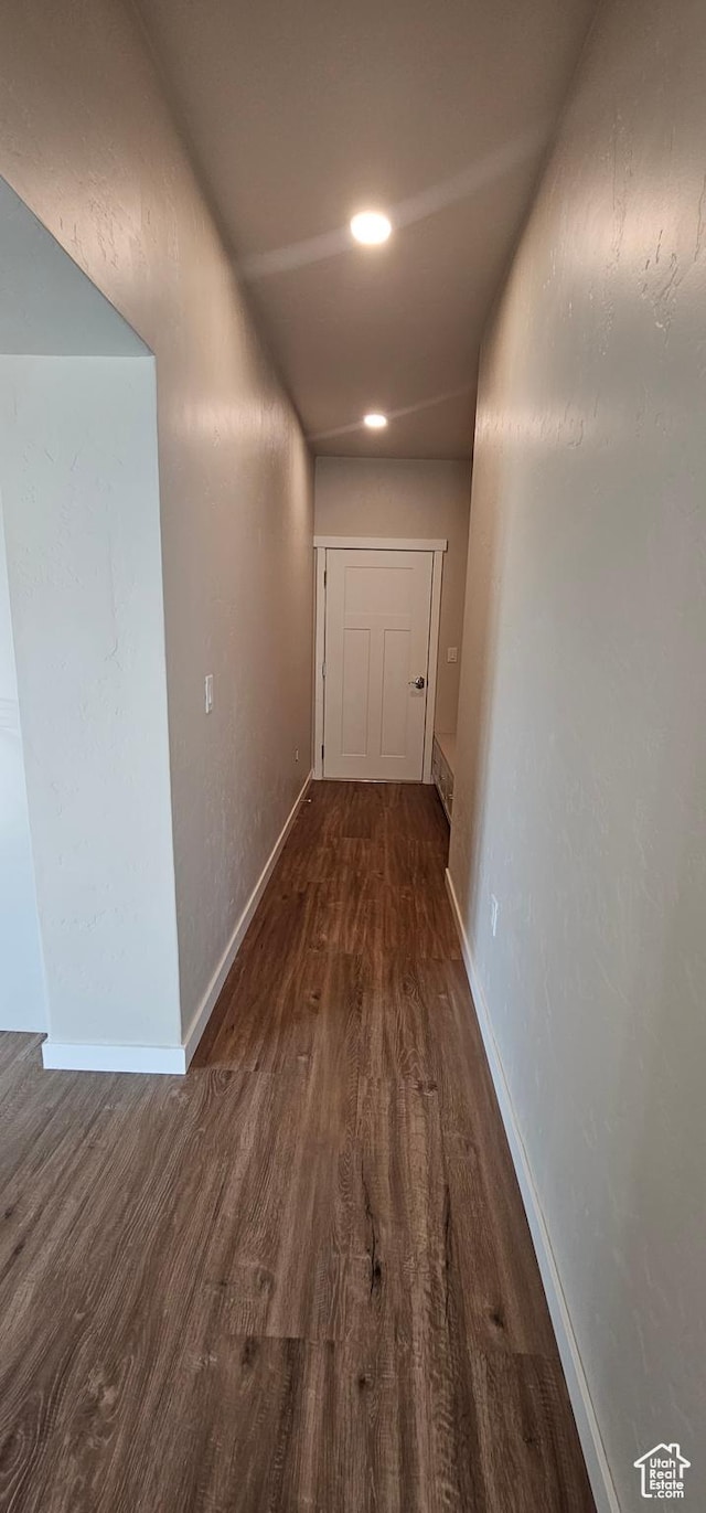 corridor featuring dark hardwood / wood-style floors