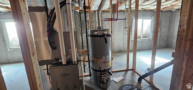 utility room featuring secured water heater
