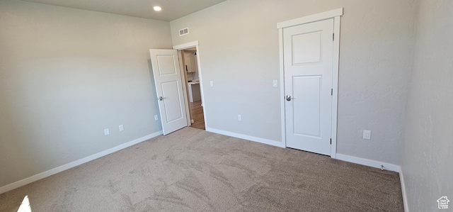 unfurnished bedroom with carpet flooring