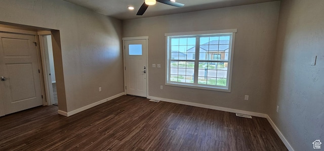 entryway featuring ceiling fan and dark wood-type flooring