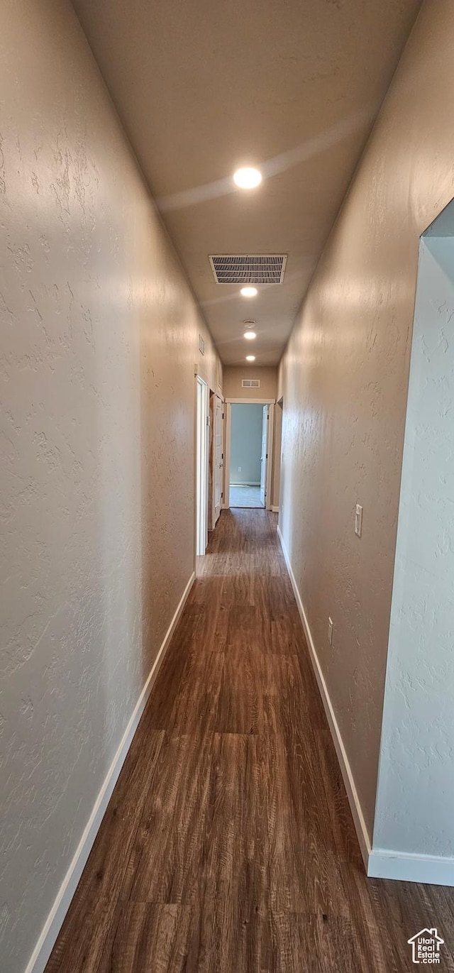 hallway featuring dark hardwood / wood-style flooring