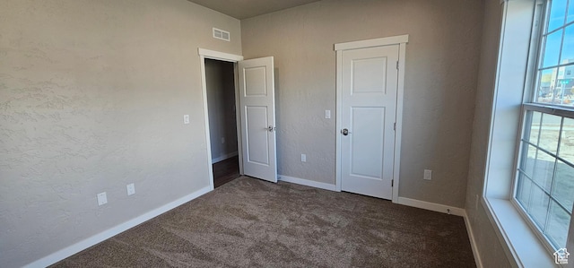 868 N 1880 E Unit 71, Price, UT 84501 - unfurnished bedroom with dark carpet