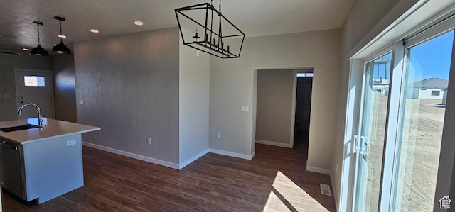 1830 E 840 N Unit 80, Price, UT 84501 - kitchen featuring dark hardwood / wood-style floors, sink, hanging light fixtures, and a kitchen island with sink