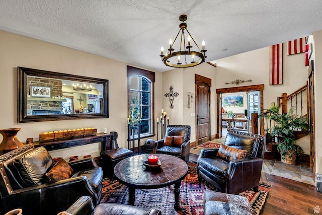 9049 N Timphaven Rd, Sundance, UT 84604 - living room featuring an inviting chandelier, a textured ceiling, and hardwood / wood-style flooring