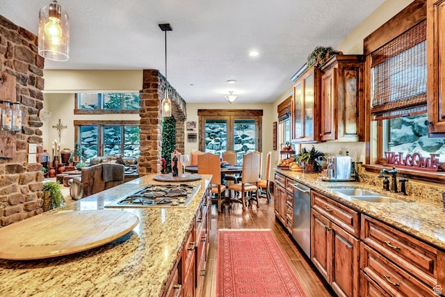 9049 N Timphaven Rd, Sundance, UT 84604 - kitchen with light stone countertops, sink, decorative light fixtures, and appliances with stainless steel finishes