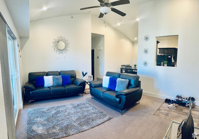 carpeted living area with recessed lighting, baseboards, high vaulted ceiling, and ceiling fan