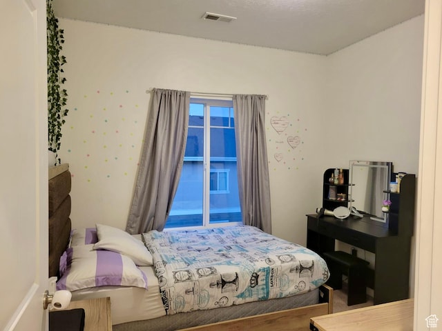 bedroom with visible vents