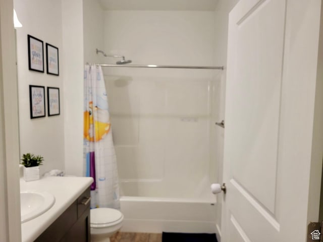 full bathroom featuring toilet, shower / bath combo, and vanity