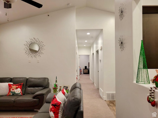 living room with baseboards, recessed lighting, ceiling fan, vaulted ceiling, and light carpet