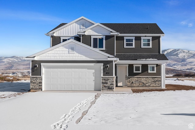 view of front of home featuring a mountain view and a garage