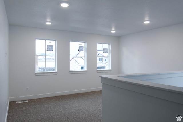 715 E 1250 S, Hyrum, UT 84319 - unfurnished room featuring dark colored carpet, recessed lighting, and baseboards