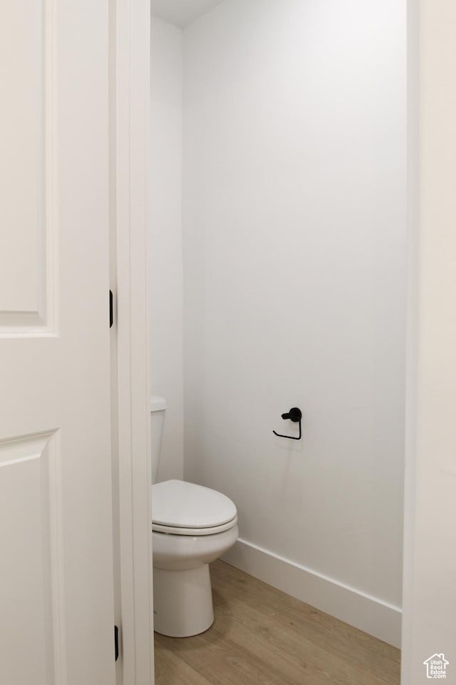 715 E 1250 S, Hyrum, UT 84319 - bathroom featuring wood finished floors, toilet, and baseboards