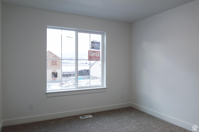 715 E 1250 S, Hyrum, UT 84319 - spare room featuring dark colored carpet and baseboards