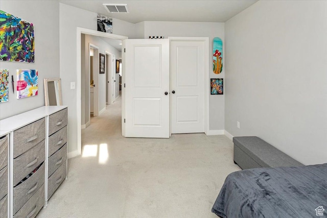 bedroom featuring light colored carpet