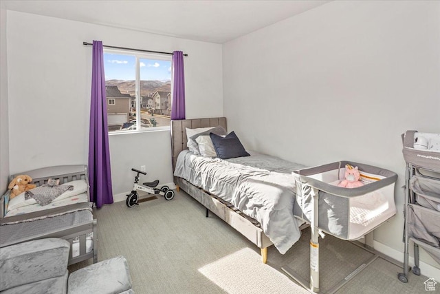 bedroom with light carpet