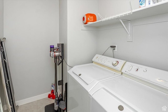 washroom with light tile patterned floors and independent washer and dryer