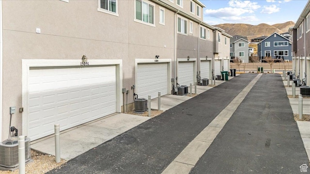 exterior space with a mountain view and central air condition unit