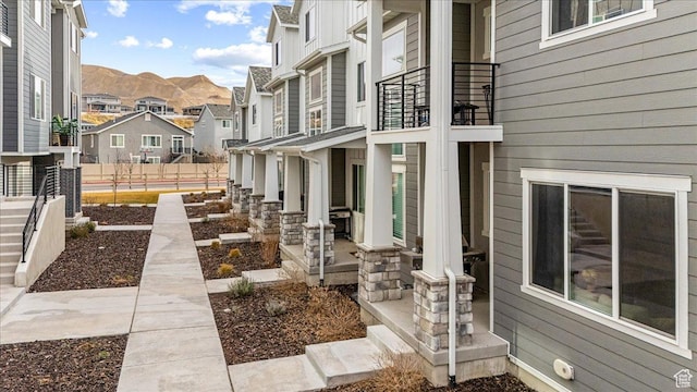 15091 S Reins Way W, Bluffdale, UT 84065 - patio / terrace with a residential view, covered porch, and a mountain view