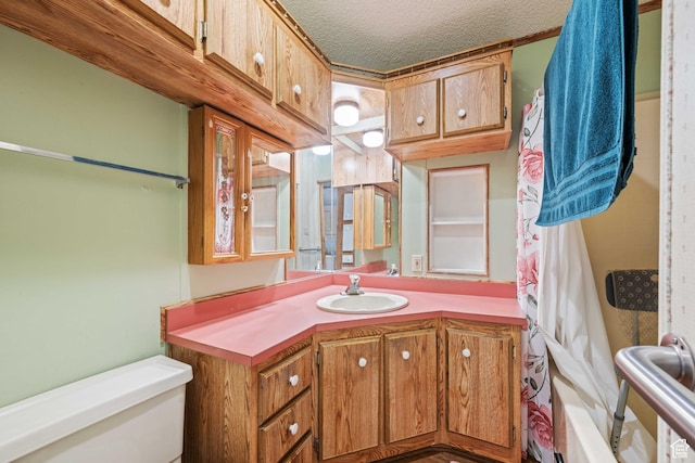 1150 W Red Hills Pkwy, Washington, UT 84780 - full bathroom with a textured ceiling, vanity, shower / tub combo, and toilet