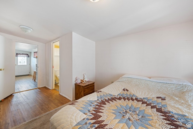 1150 W Red Hills Pkwy, Washington, UT 84780 - bedroom with wood-type flooring and ensuite bathroom