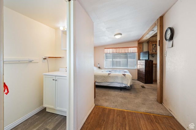1150 W Red Hills Pkwy, Washington, UT 84780 - bedroom featuring vaulted ceiling and dark wood-type flooring