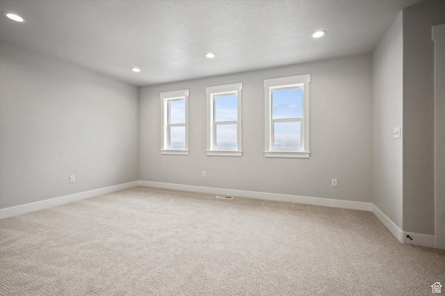 562 S 1140 E Unit 1206, Smithfield, UT 84335 - spare room with recessed lighting, light colored carpet, and a healthy amount of sunlight