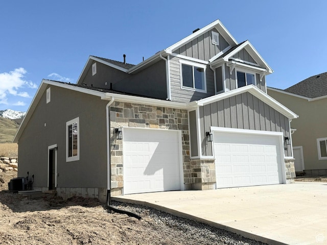 562 S 1140 E Unit 1206, Smithfield, UT 84335 - craftsman-style house featuring board and batten siding, a garage, cooling unit, stone siding, and concrete driveway