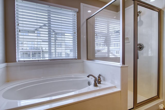 bathroom featuring plus walk in shower